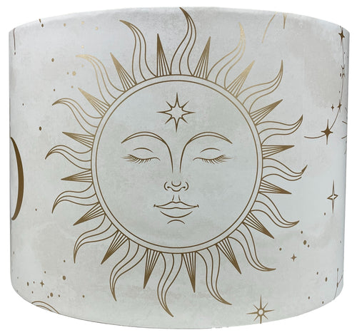 Celestial lampshade featuring gold sun, moon, and star design on a white background.