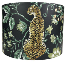 Load image into Gallery viewer, Cheetah lampshade featuring exotic jungle design with green floral leaves on black background.