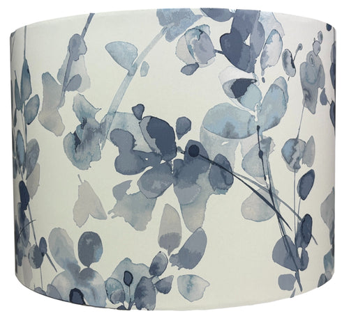 Stylish blue floral lampshade for living rooms, bedrooms, and nurseries, featuring a delicate flower design and metallic shimmer.