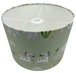 Jungle themed lampshade with safari animals, perfect for a bedroom or nursery decor.