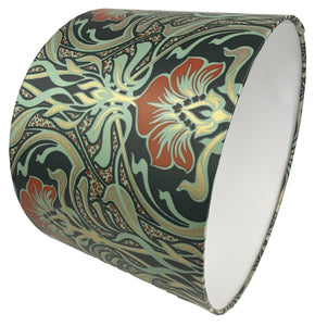 Art Nouveau lampshade showcasing intricate blue, green, and orange motifs.