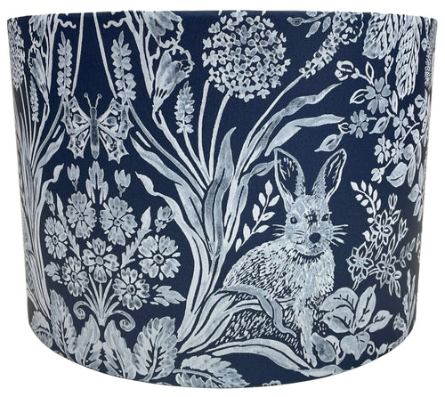 Navy blue lampshade featuring a woodland rabbit design with tree and leaf motifs.
