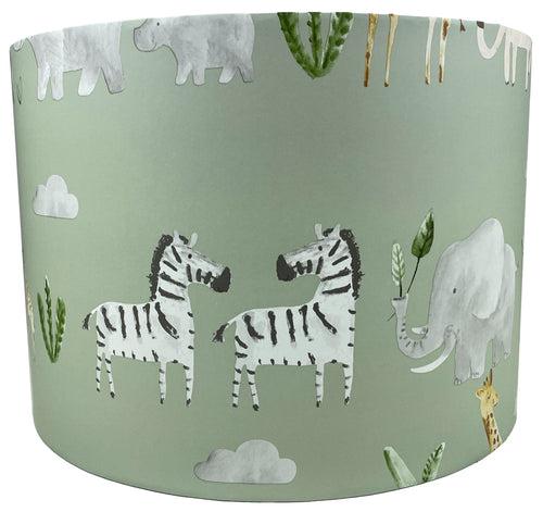 Safari animal lampshade featuring elephant, zebra, and giraffe on a green background for kids' rooms and nurseries.