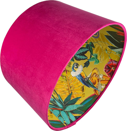 Hot pink velvet lampshade featuring a tropical jungle design with crowned parrots and a chameleon in a top hat.