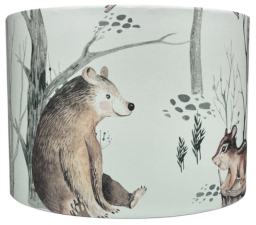 Handcrafted woodland animal lampshade featuring bear, owl, and chipmunk on a white background.